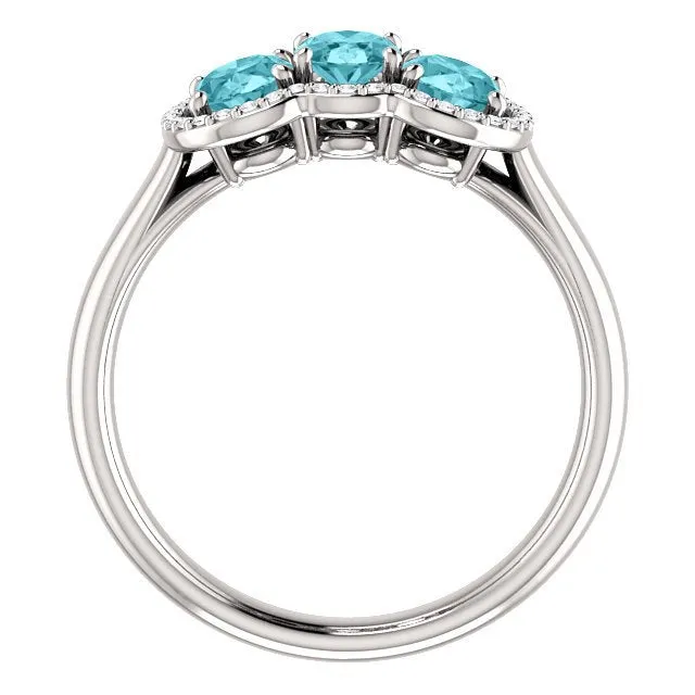 14KT GOLD 2.25 CTW BLUE ZIRCON & 0.10 CTW DIAMOND 3 STONE OVAL HALO RING