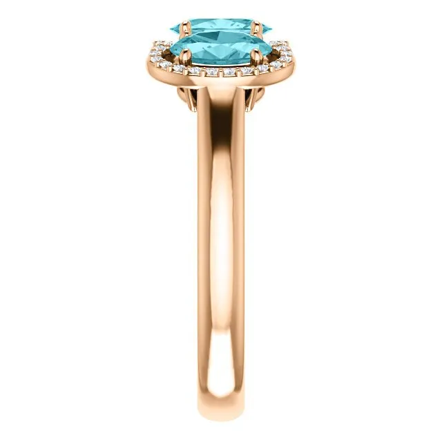 14KT GOLD 2.25 CTW BLUE ZIRCON & 0.10 CTW DIAMOND 3 STONE OVAL HALO RING