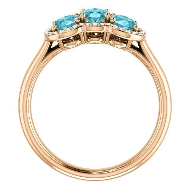 14KT GOLD 2.25 CTW BLUE ZIRCON & 0.10 CTW DIAMOND 3 STONE OVAL HALO RING