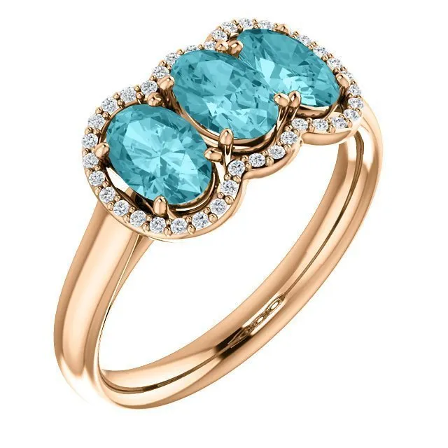 14KT GOLD 2.25 CTW BLUE ZIRCON & 0.10 CTW DIAMOND 3 STONE OVAL HALO RING