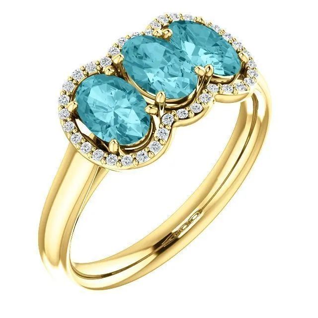 14KT GOLD 2.25 CTW BLUE ZIRCON & 0.10 CTW DIAMOND 3 STONE OVAL HALO RING