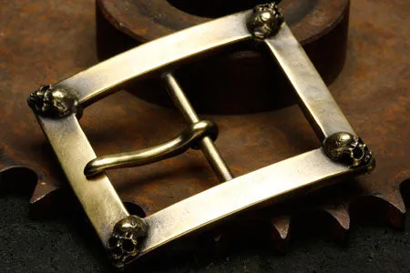 Four Skull Brass Belt Buckle